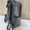 Genuine black leather laptop backpack with padded straps and side pockets Genuine black leather laptop backpack with padded straps and side pockets