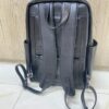 Genuine black leather laptop backpack with padded straps and side pockets Genuine black leather laptop backpack with padded straps and side pockets
