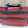 Genuine red and black leather laptop bag with zip-around opening and contrast trim