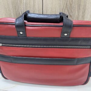 Genuine red and black leather laptop bag with zip-around opening and contrast trim