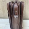 Genuine brown leather multi-pocket backpack with lock closure and adjustable straps Genuine brown leather multi-pocket backpack with lock closure and adjustable straps