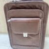 Genuine brown leather multi-pocket backpack with lock closure and adjustable straps Genuine brown leather multi-pocket backpack with lock closure and adjustable straps