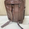 Genuine brown leather multi-pocket backpack with lock closure and adjustable straps Genuine brown leather multi-pocket backpack with lock closure and adjustable straps